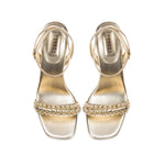 Kibele Sahara Ankle Cross Sandal in shimmering metallic leather with intricate embroidery and a stiletto heel, perfect for elegant occasions.