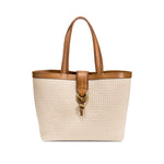 Boho chic medium off white tote bag with a stylish brown handle and decorative clasp on a white background.