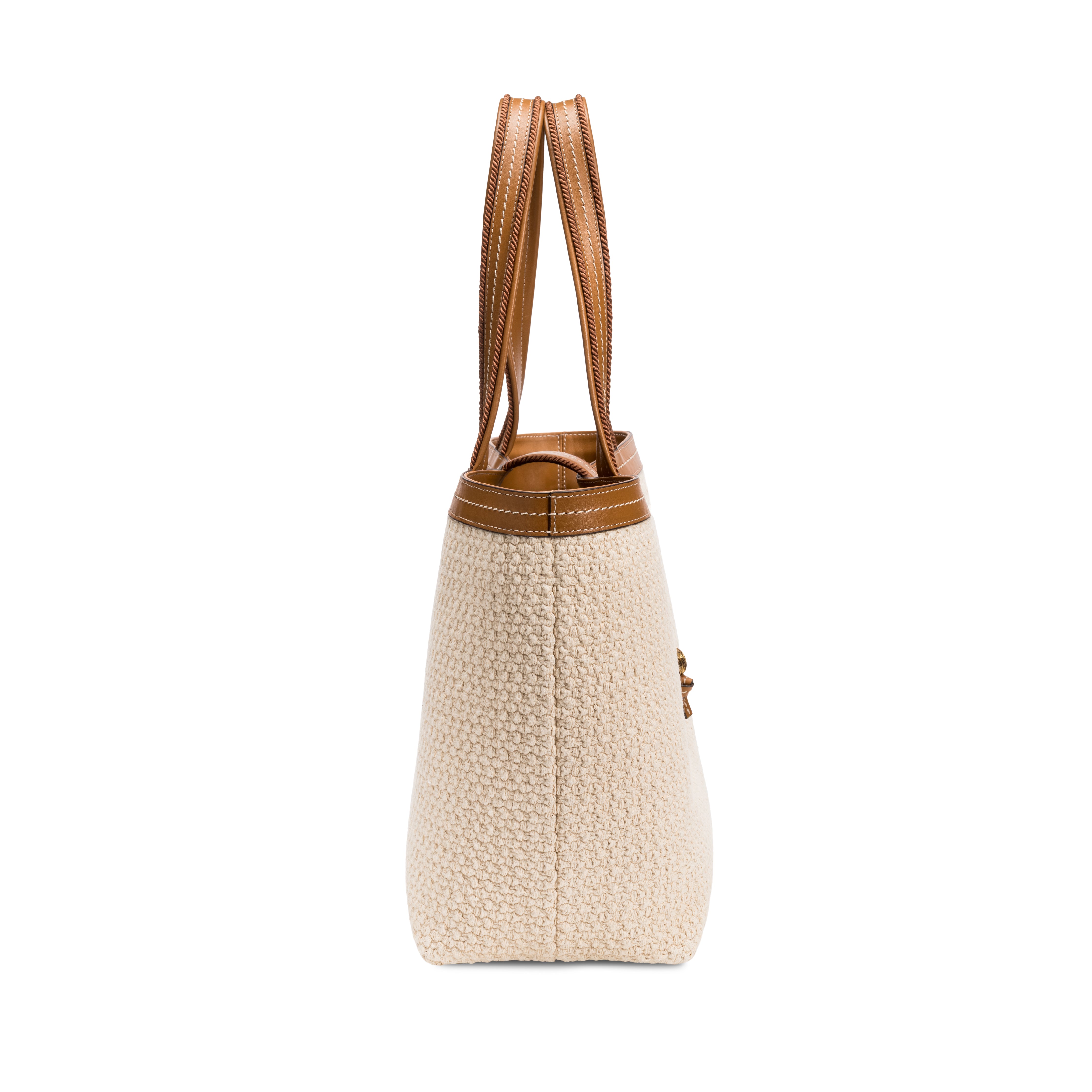 Side view of a boho chic medium off-white tote bag with brown leather straps, perfect for stylish everyday use.