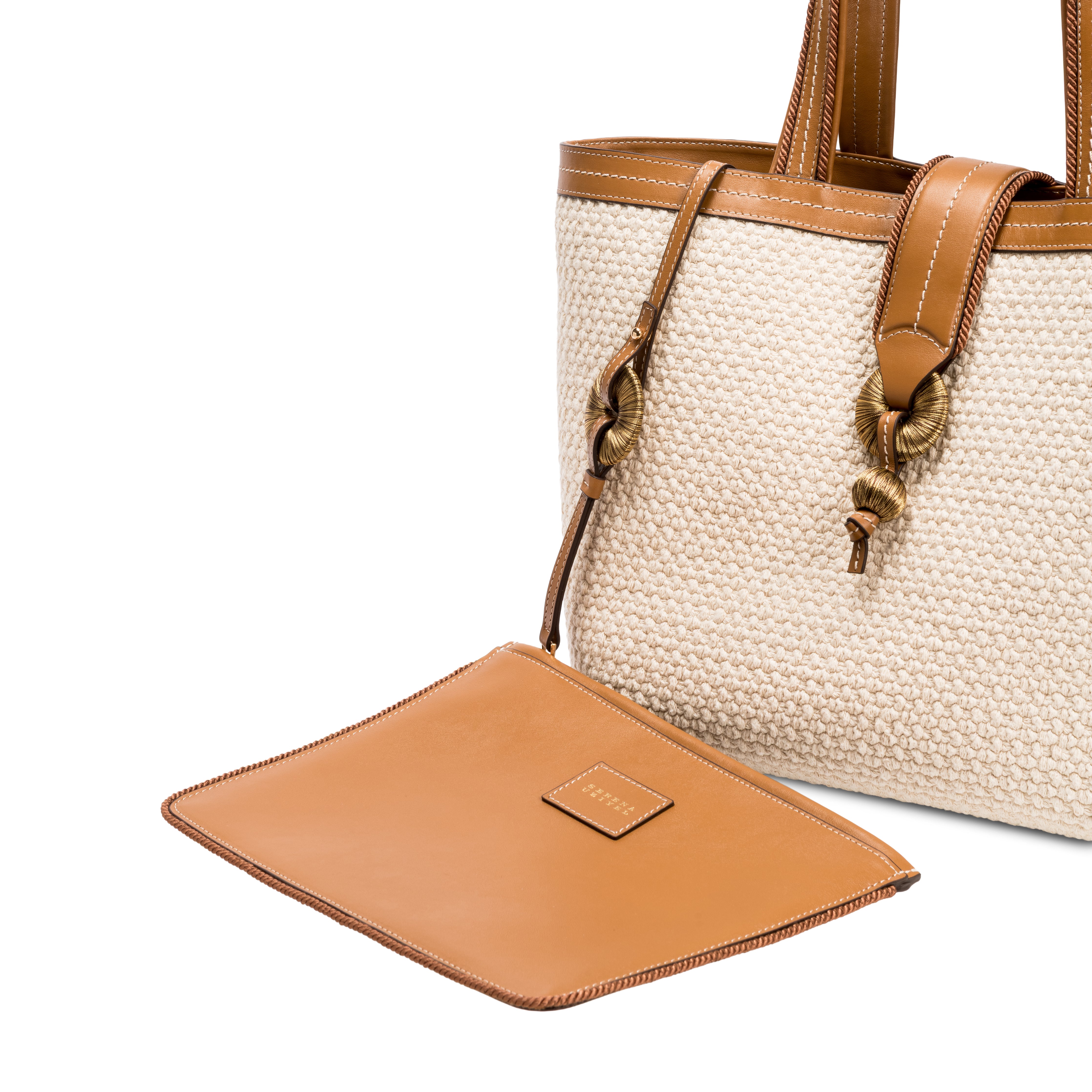 Boho chic medium off white tote bag with brown leather accents and detachable pouch, perfect for stylish outings.