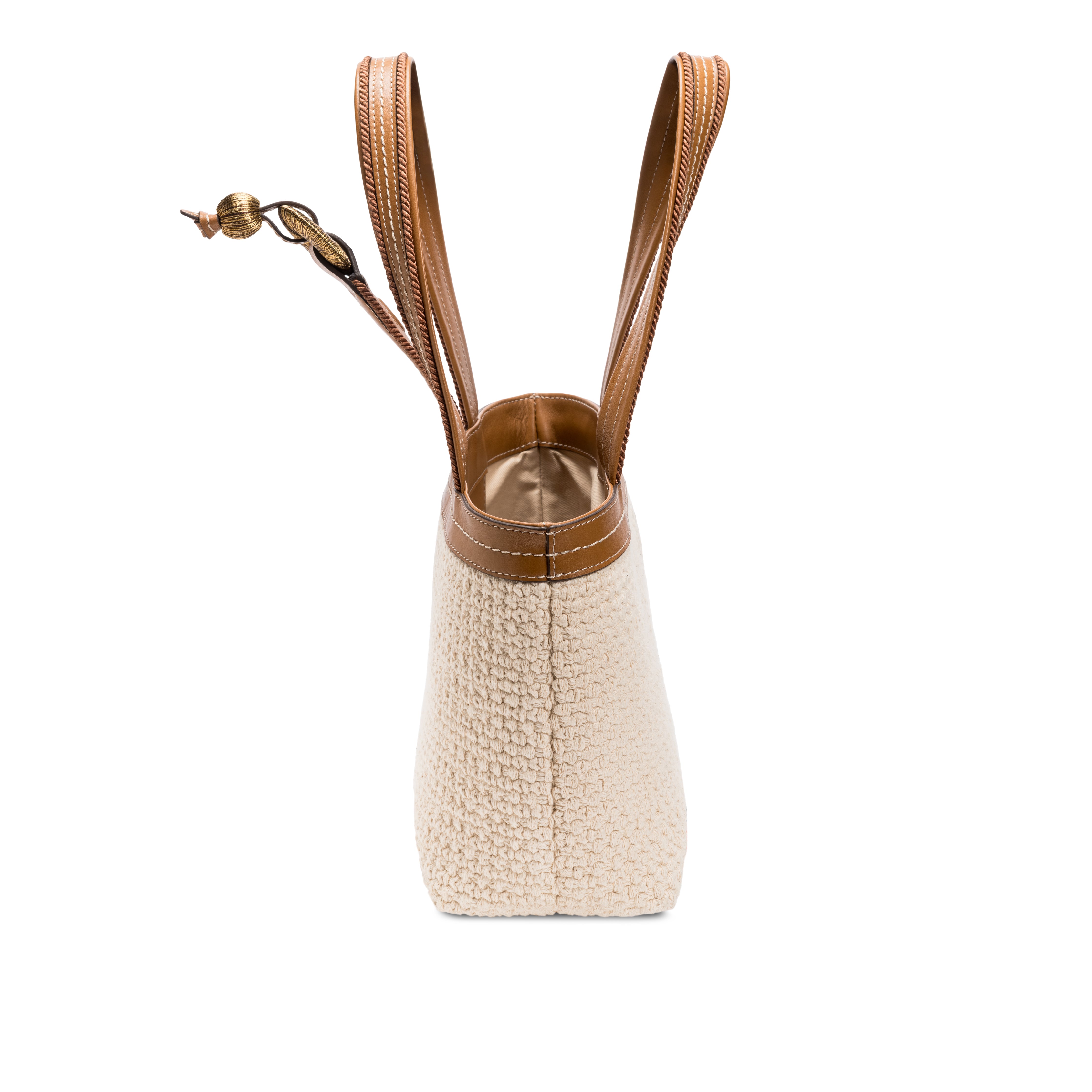 Boho chic small off white tote bag with brown straps and a unique texture, perfect for casual outings.