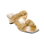 Rhea Gold 2 Knot Sandal featuring a comfortable block heel and intricately knotted crochet straps in gold.