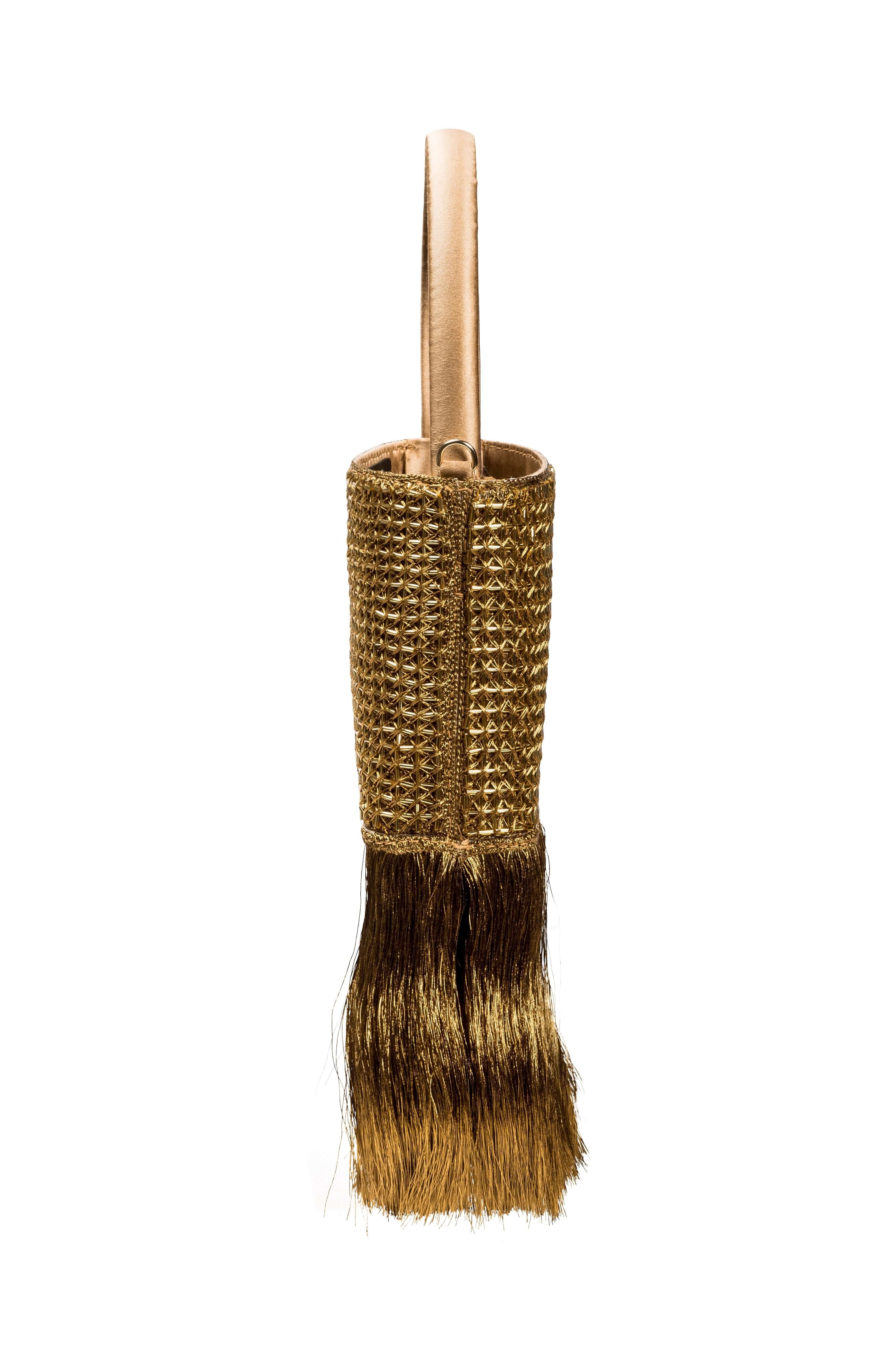 Adia Antique Gold Mini Tote Bag featuring metallic cage embroidery and fringe details, ideal for any occasion.