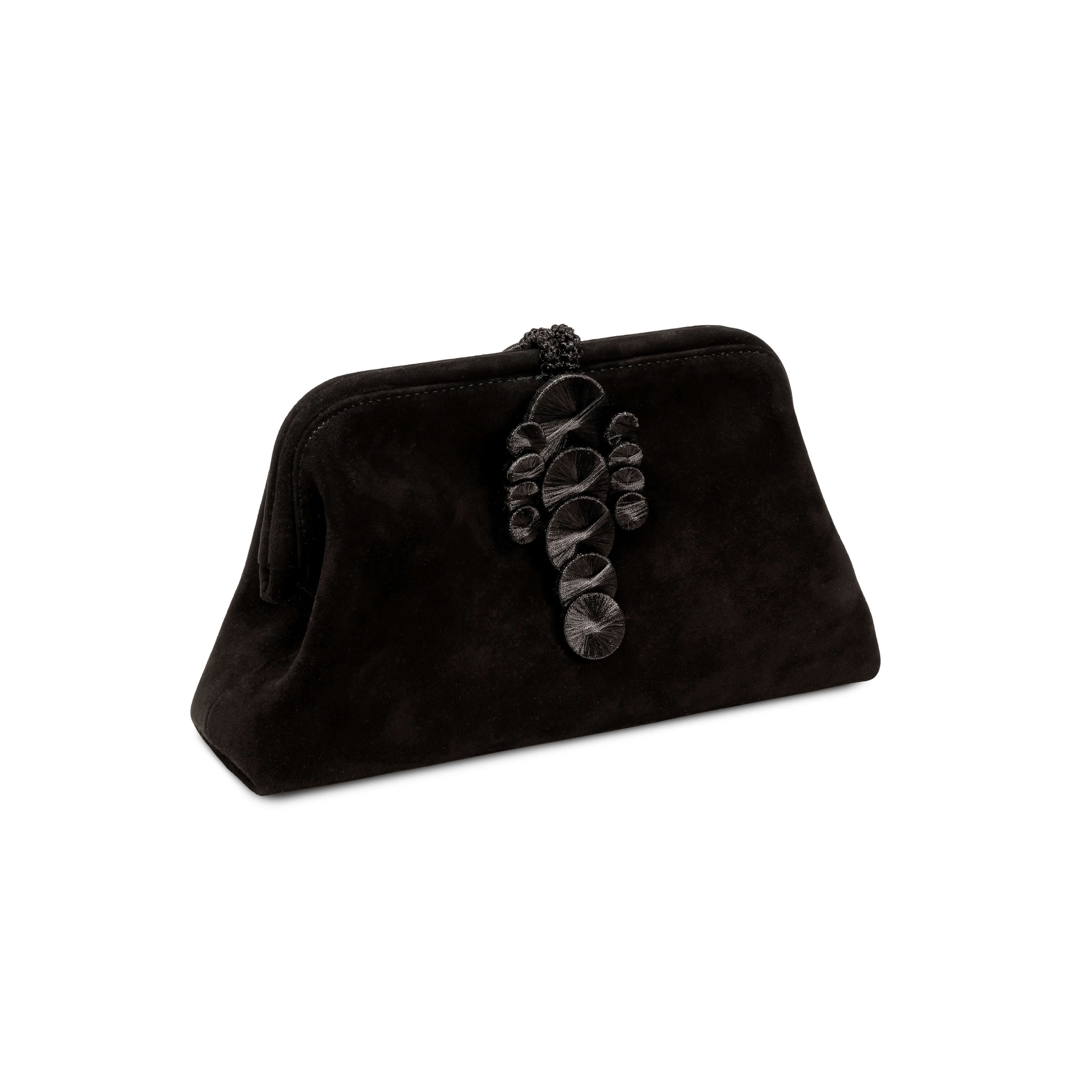 Alessa Black Pouch Bag featuring an intricate thread-wrapped coin design and tassel for an elegant touch.