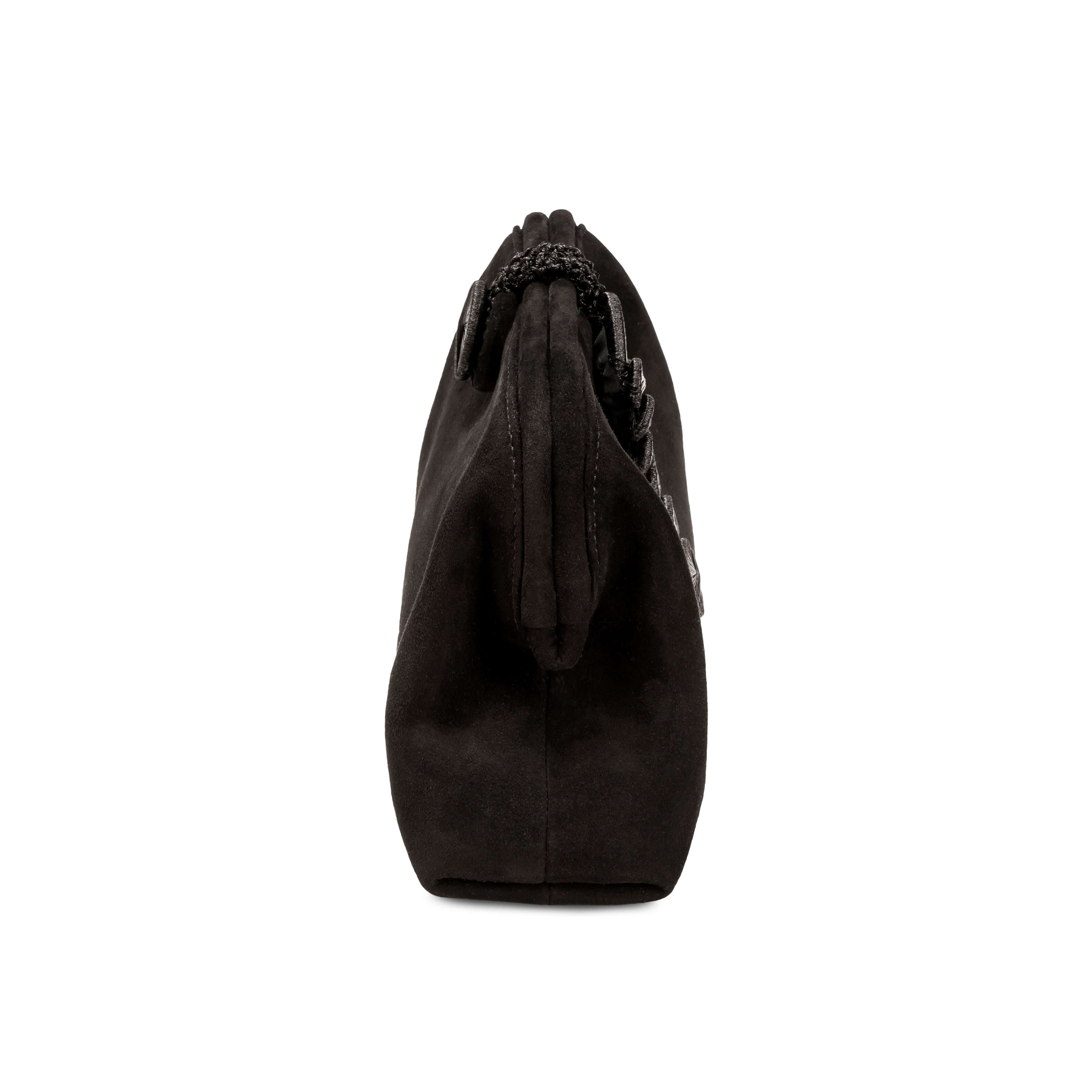 Alessa Black Pouch Bag showcasing its unique knotted design and luxurious leather material.