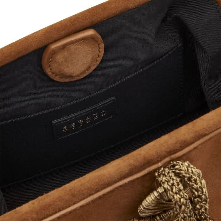 Interior view of the Alessa Camello Pouch Bag showcasing its rich suede leather and magnetic closure detail.