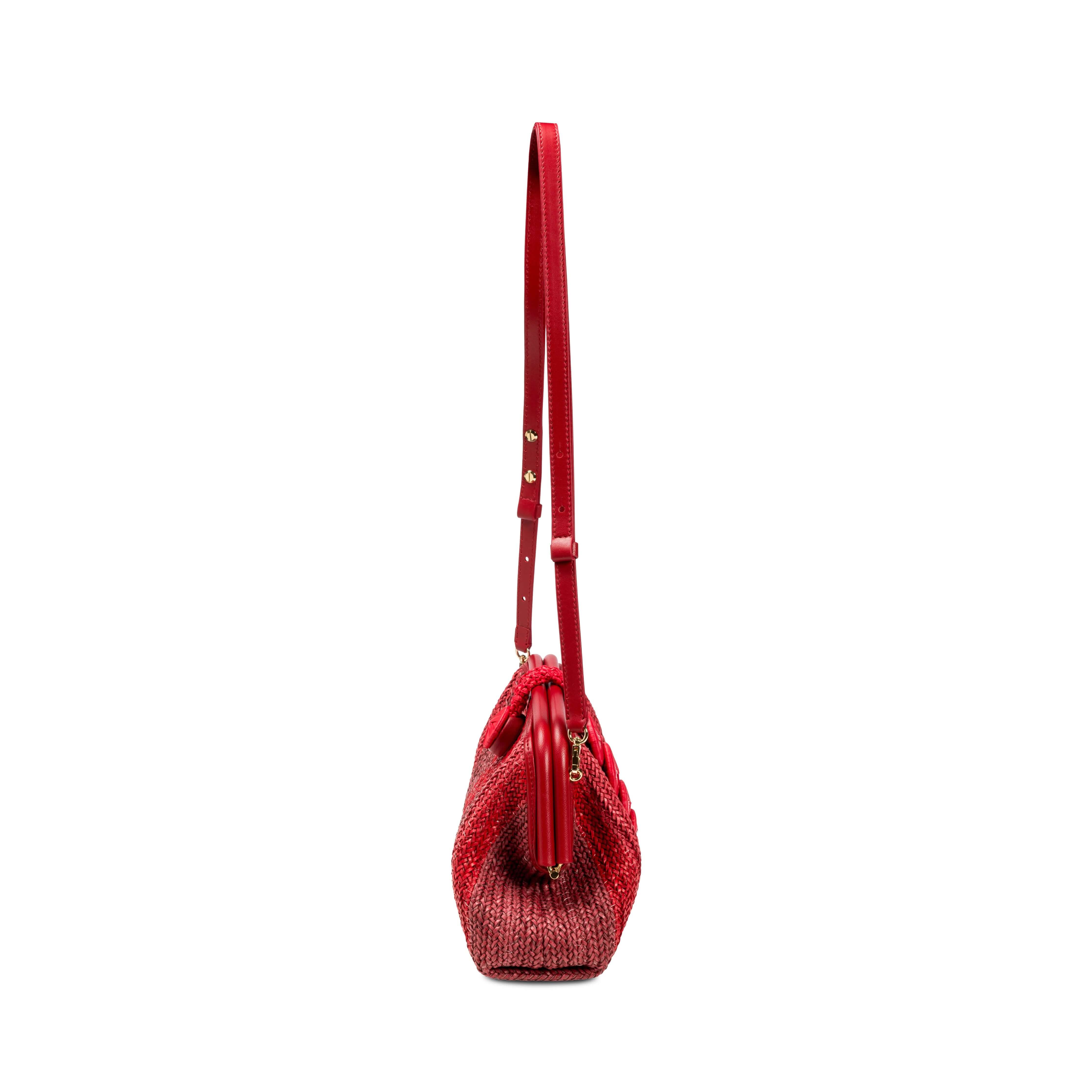Alessa Scarlet Pouch Bag featuring a stylish red design and adjustable shoulder strap.