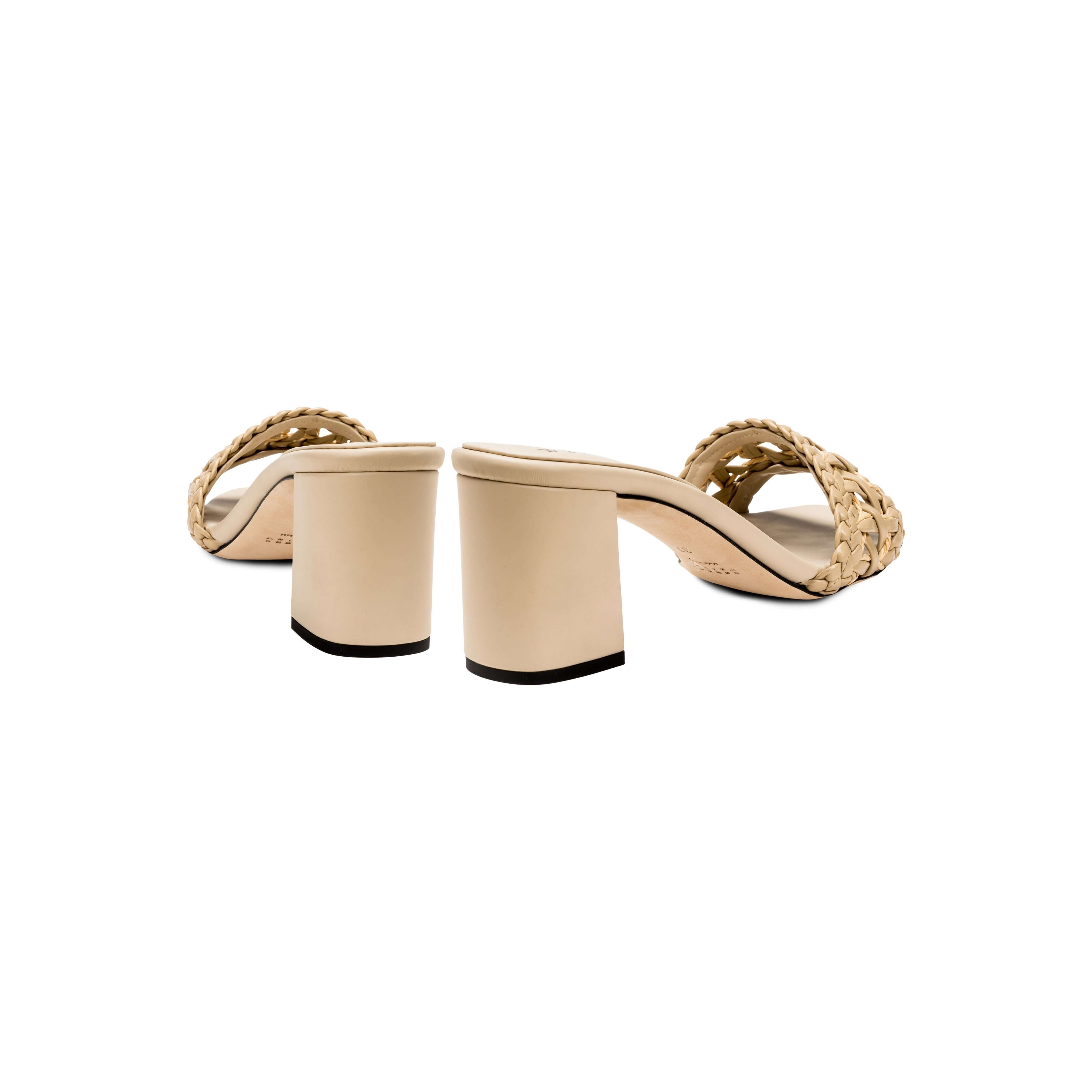 Almeria Nude Block-Heel Sandals showcasing a braided strap and mid-height block heel, crafted from supple nude leather.