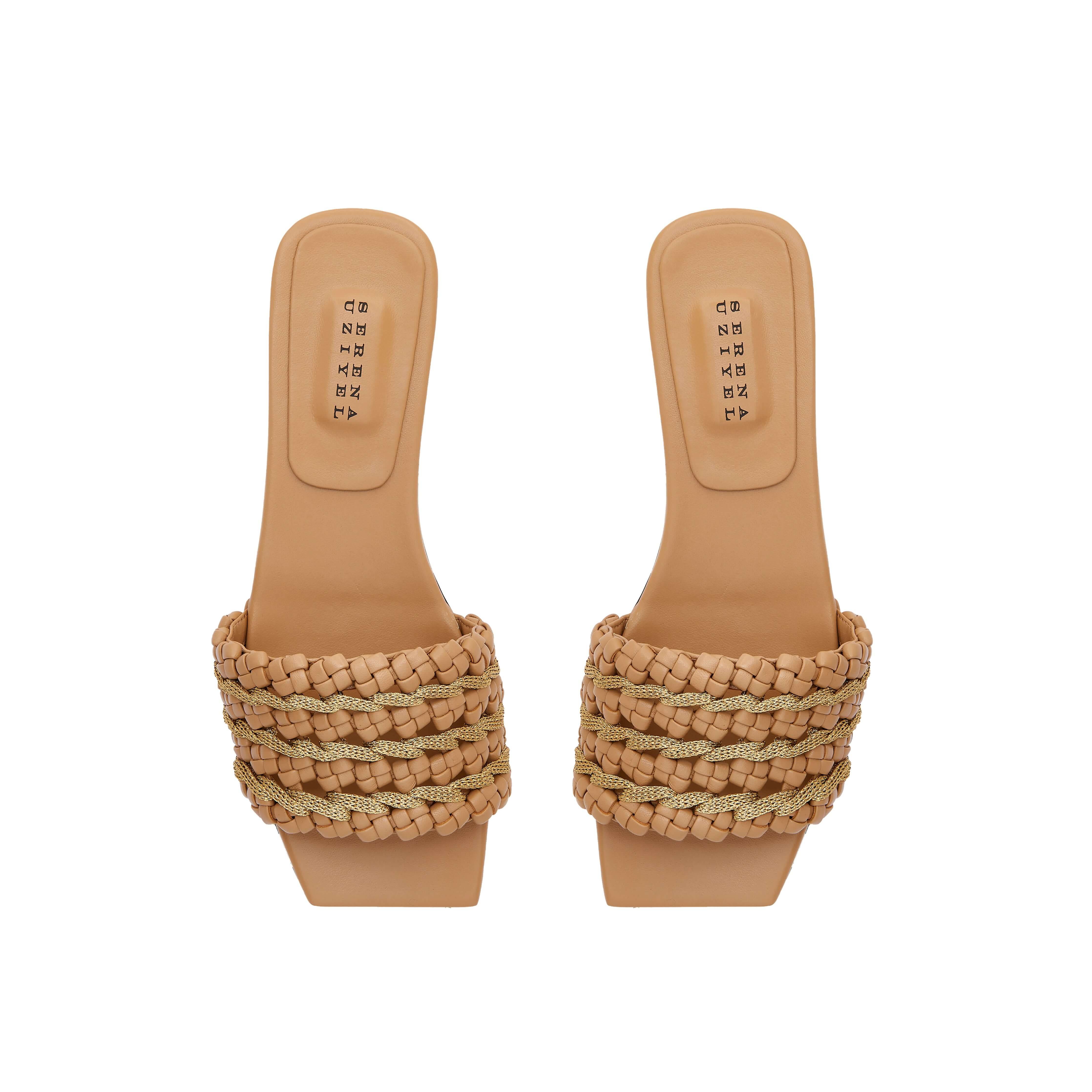 Aurnia Latte Flat Sandal featuring stylish woven straps and a comfortable flat sole, perfect for casual summer outings.