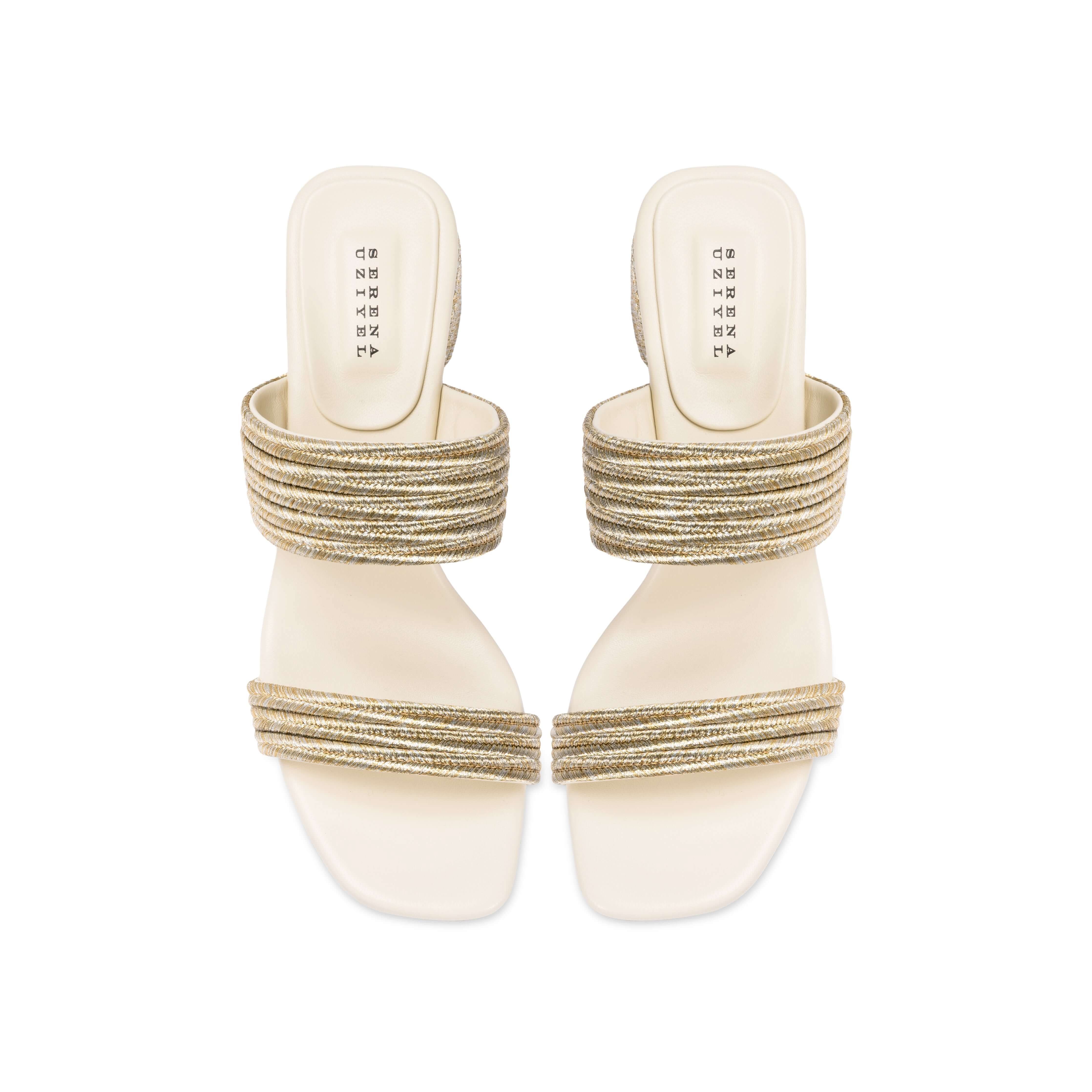Bellina Ivory Two Strap Sandal with intricately braided straps and shimmering metallic threads, set on a 60mm block heel.