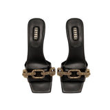 Catena Black Mid-Heel Sandal featuring a gold chain link design, elegantly crafted from Italian leather.