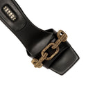 Stylish Catena Black Mid-Heel Sandal featuring antique gold chain link design on toe strap.