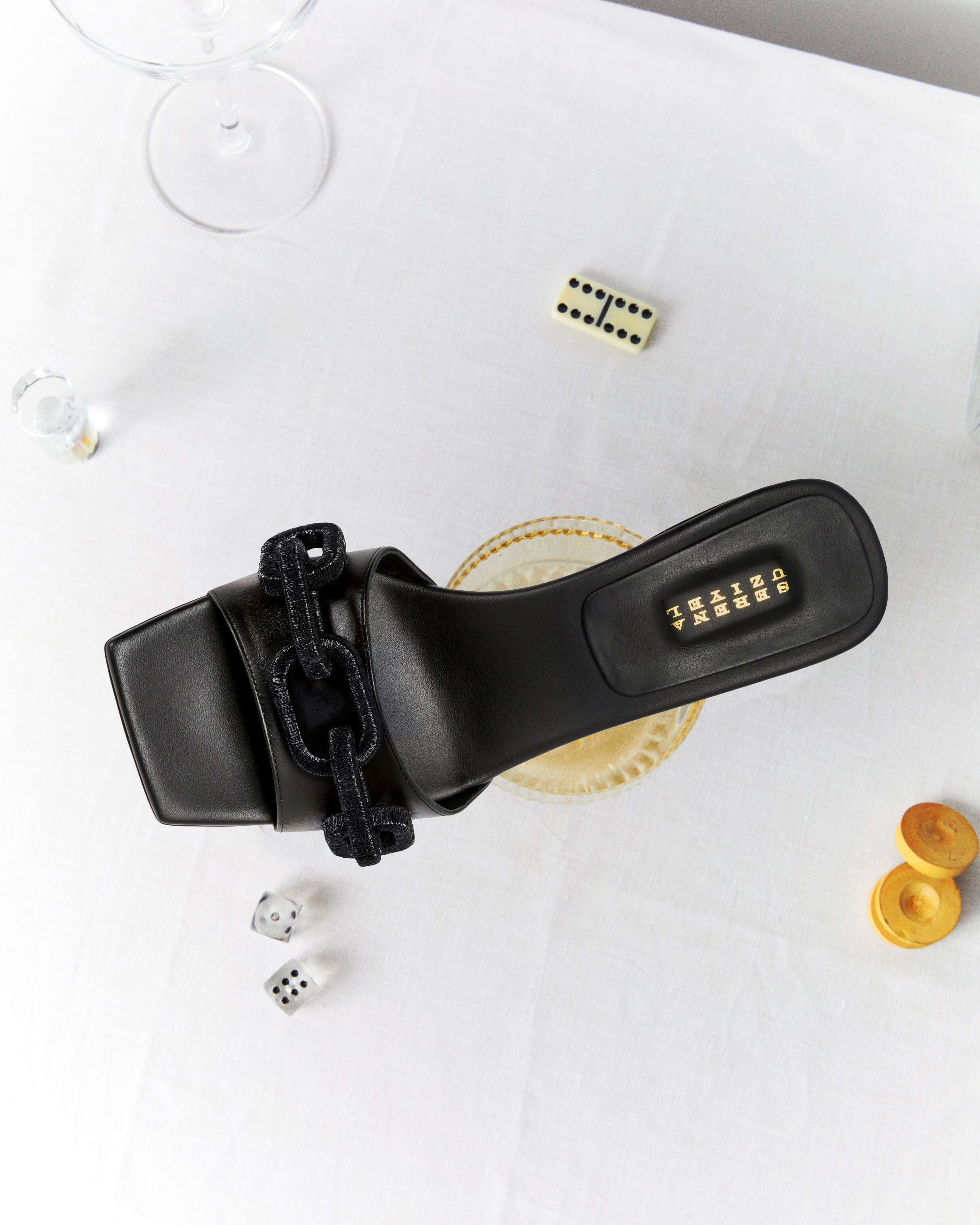 Top view of Catena Black Mid-Heel Sandal featuring chain link design on the toe strap, perfect for elegant occasions.