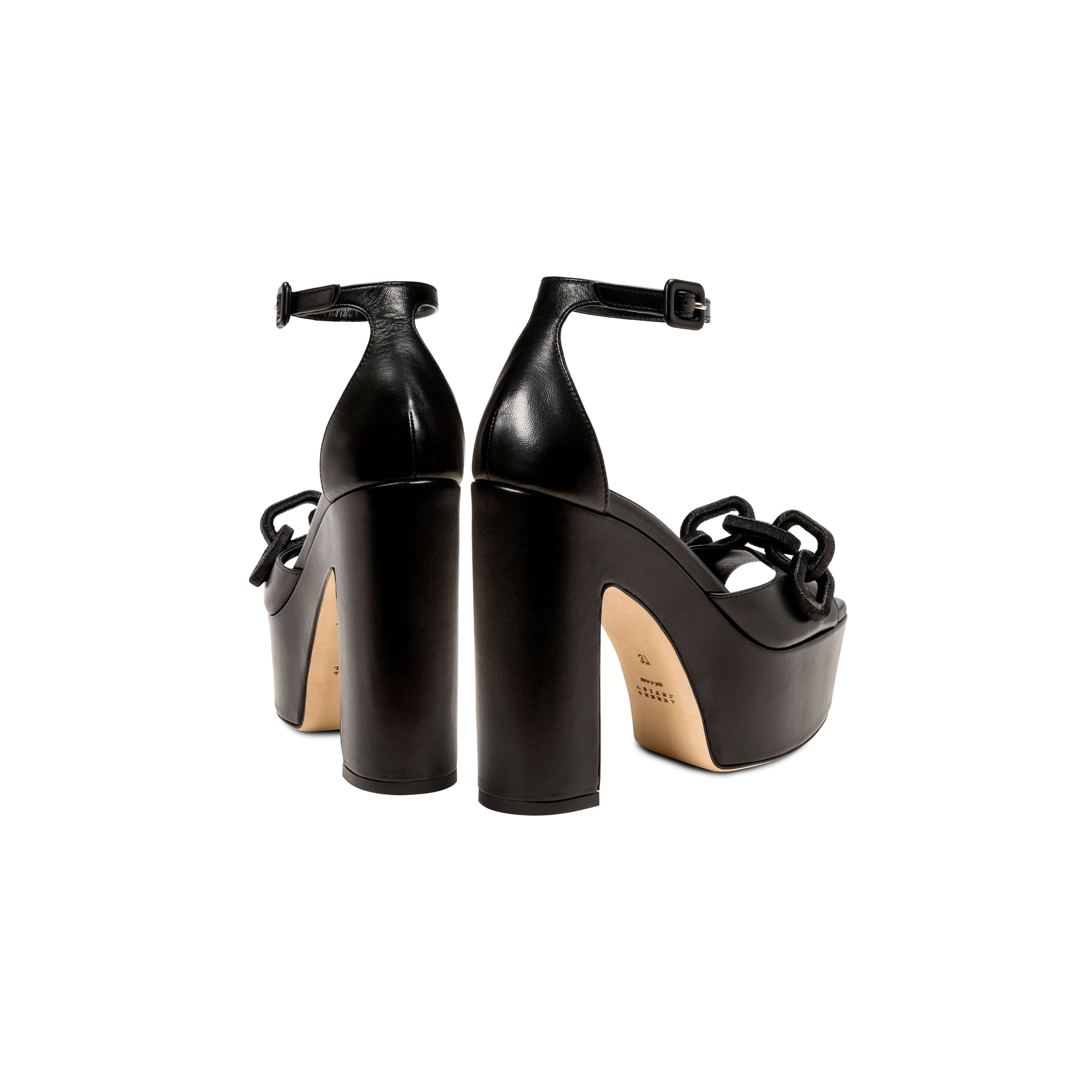 Elegant Catena Black Platform Ankle Sandals featuring chunky block heels and wrapped chain embellishments.