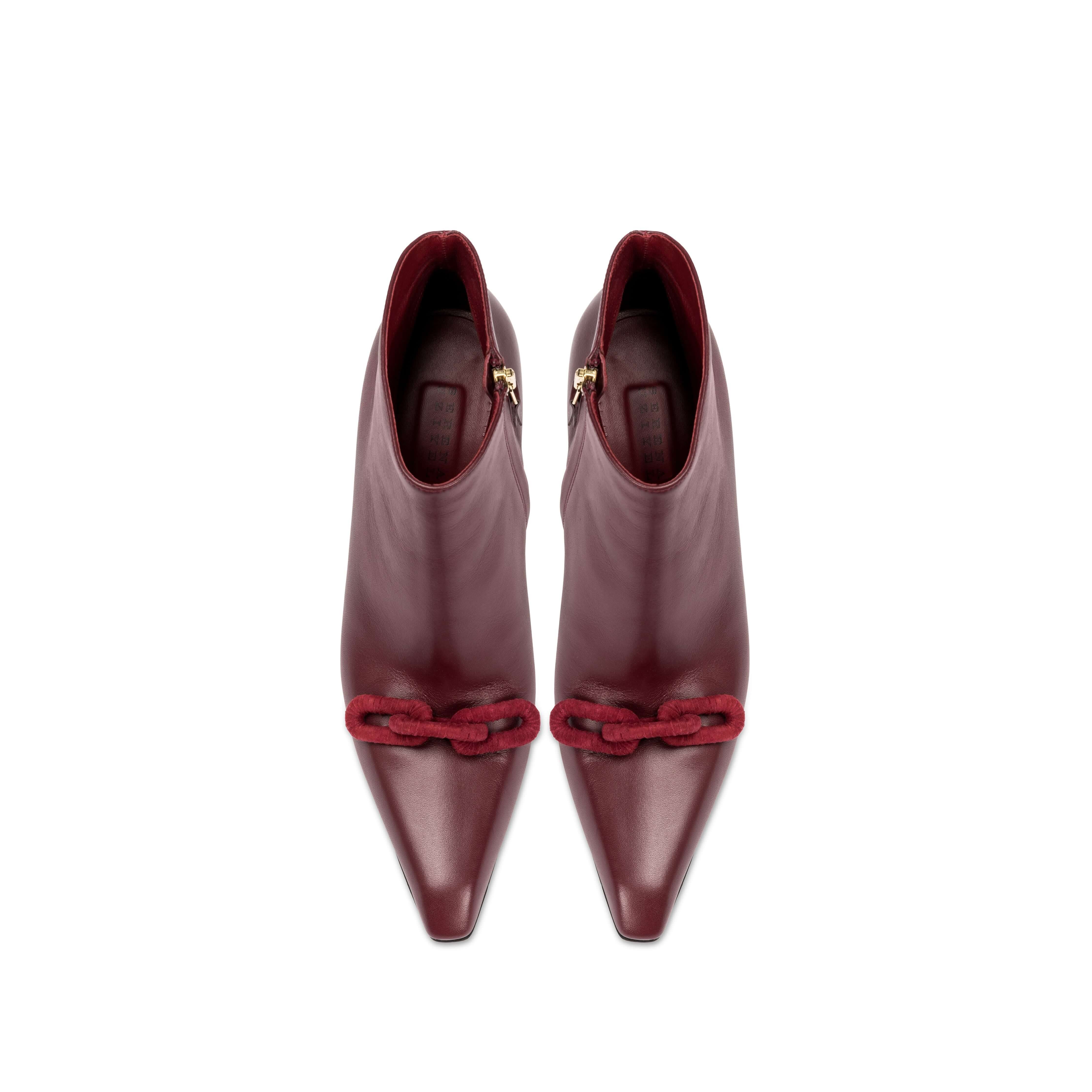 Catena Burgundy High-Heel Ankle Boot with pointed toe and suede chain link detail.