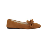 Catena Camello Off White Shearling Flat Moccasin showcasing a stylish design with a comfortable silhouette and unique bow detail.