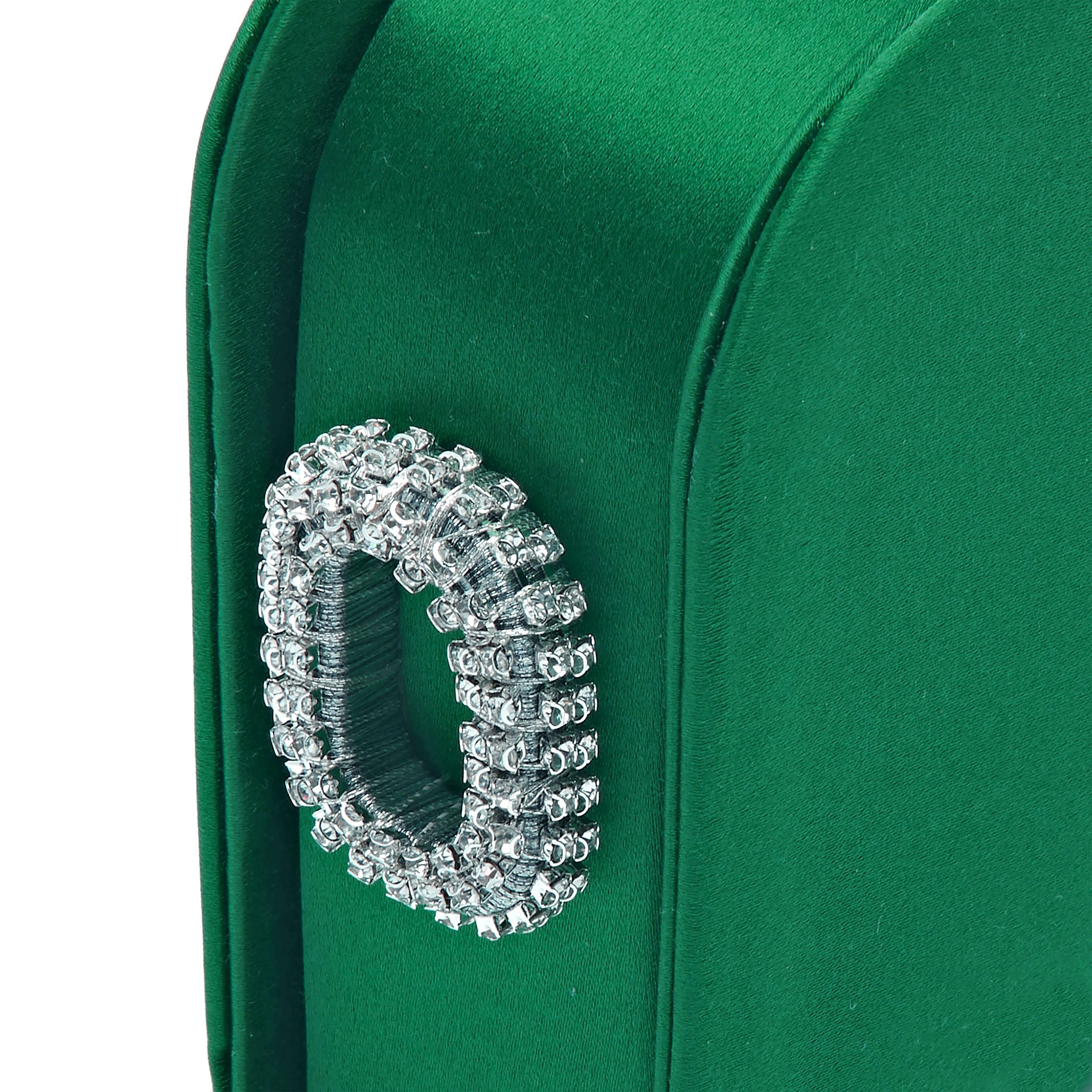 Close-up of Catena Emerald One Two Sided Clutch with crystal embellishment and luxurious green silk satin fabric.