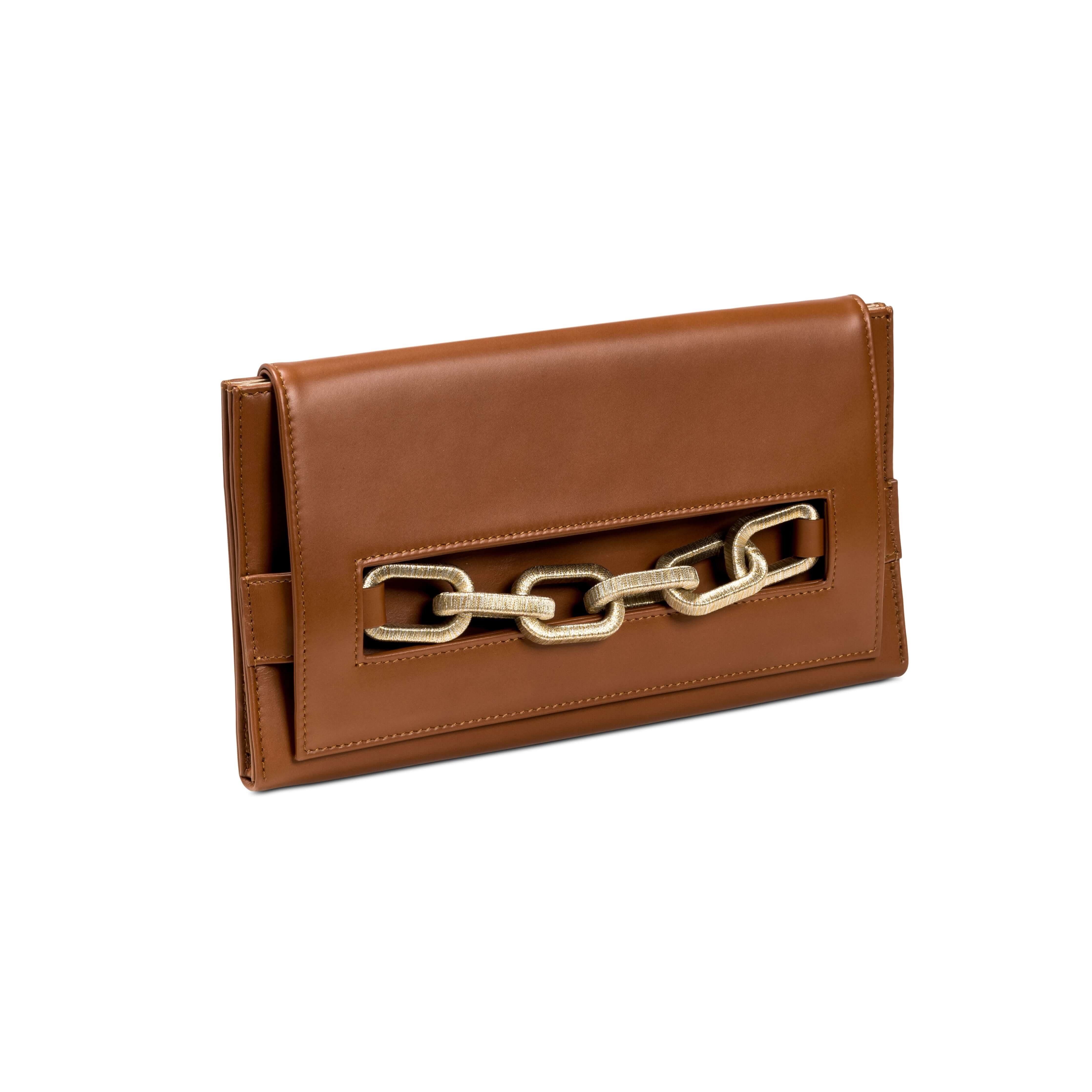 Elegant brown leather clutch featuring a distinctive gold and silver chain design, perfect for stylish outings.