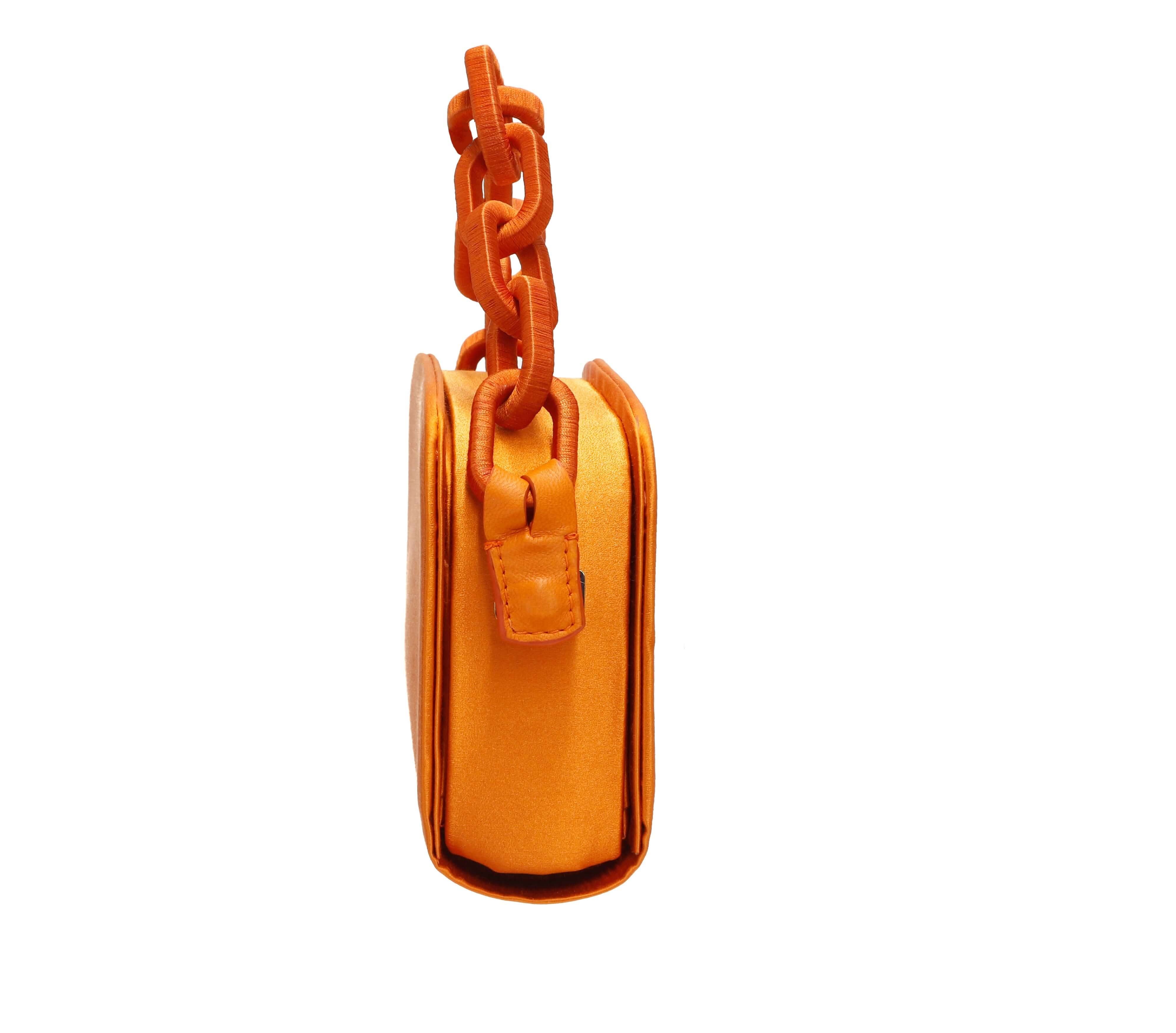 Stylish Catena Tangerine Two Sided Bag featuring a vibrant orange design with a chic chain strap.