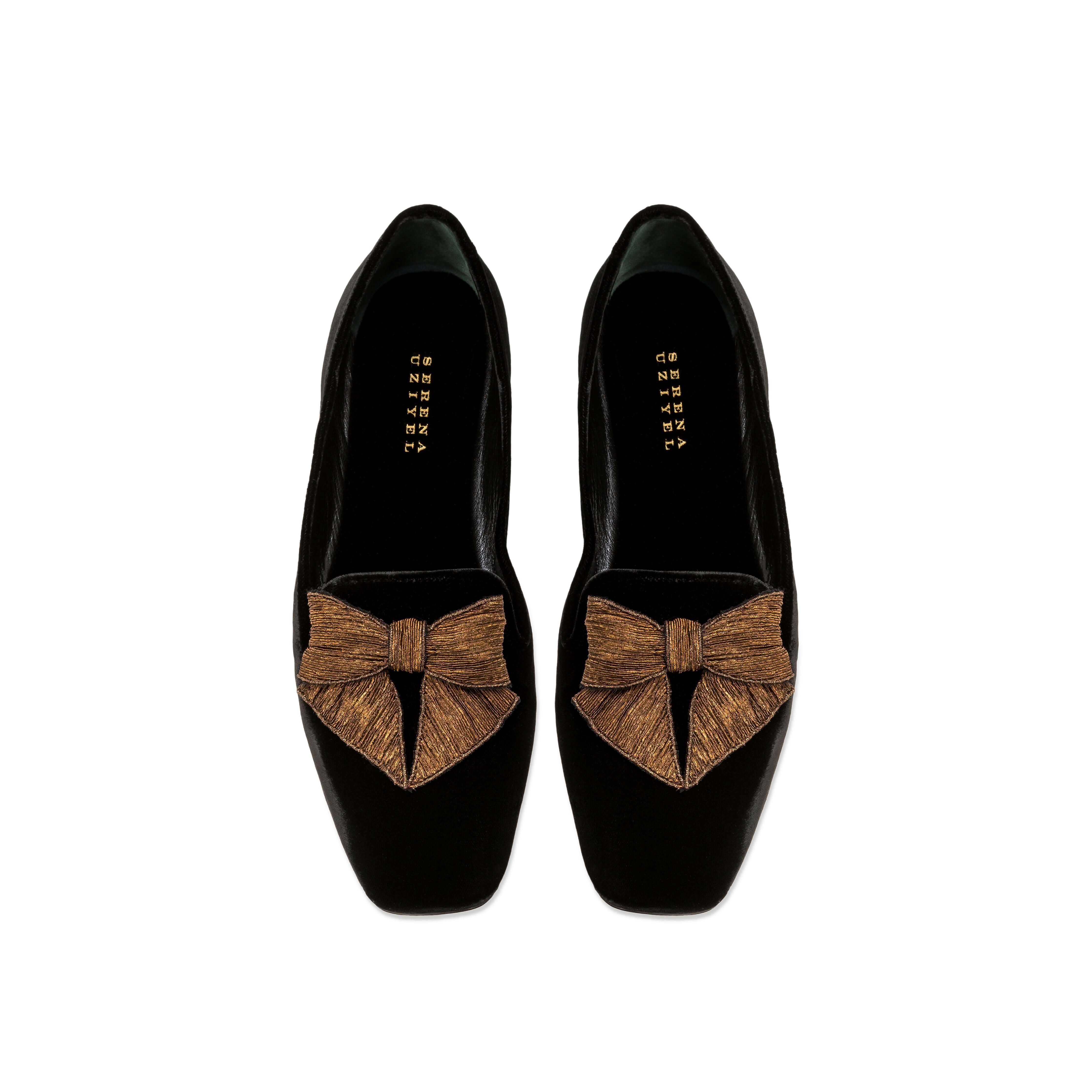 Fiocco black velvet flat moccasin with antique gold embroidered bow, highlighting comfort and chic autumn style.