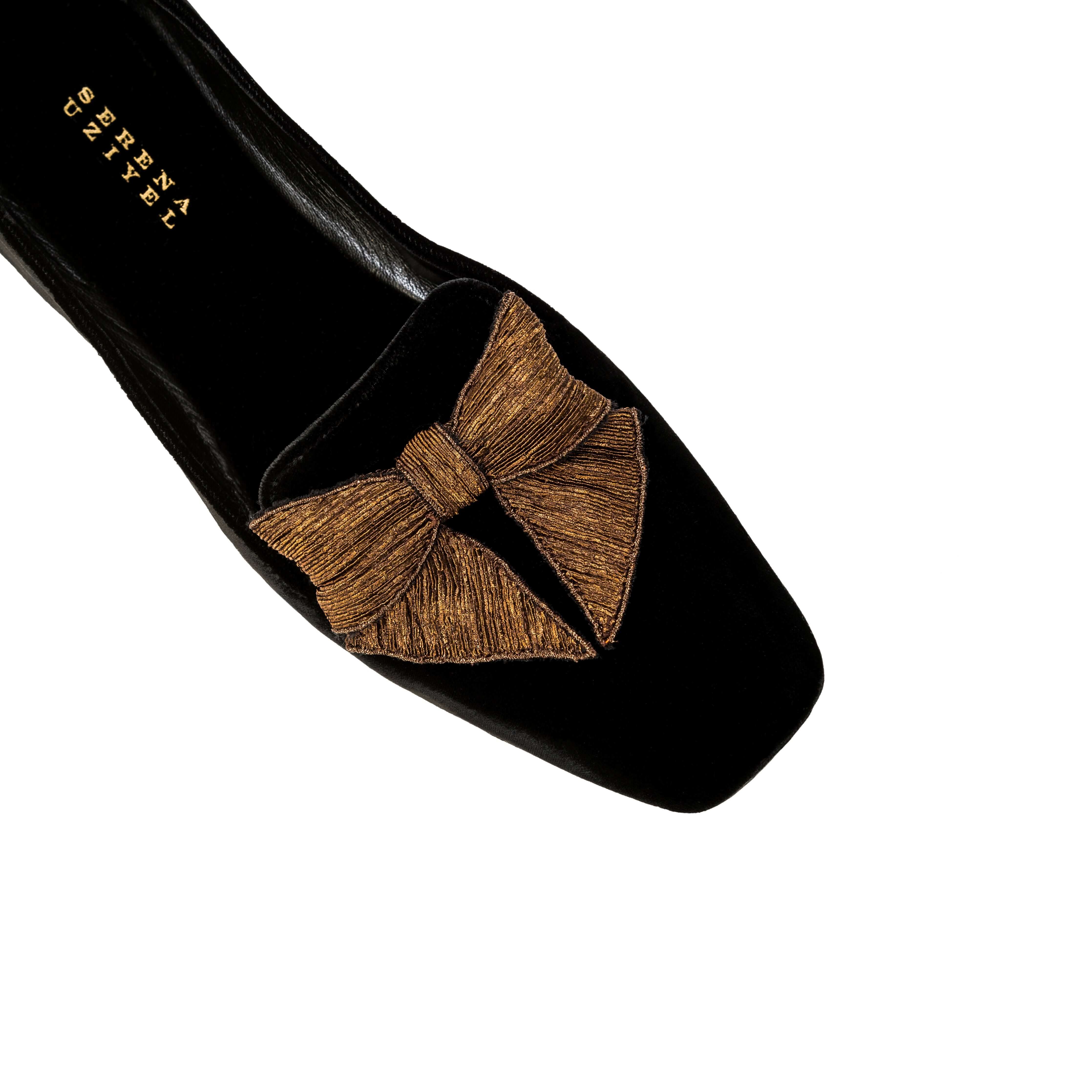 Fiocco Black Velvet Flat Moccasin with antique gold bow embroidery, handcrafted for comfort and elegance.