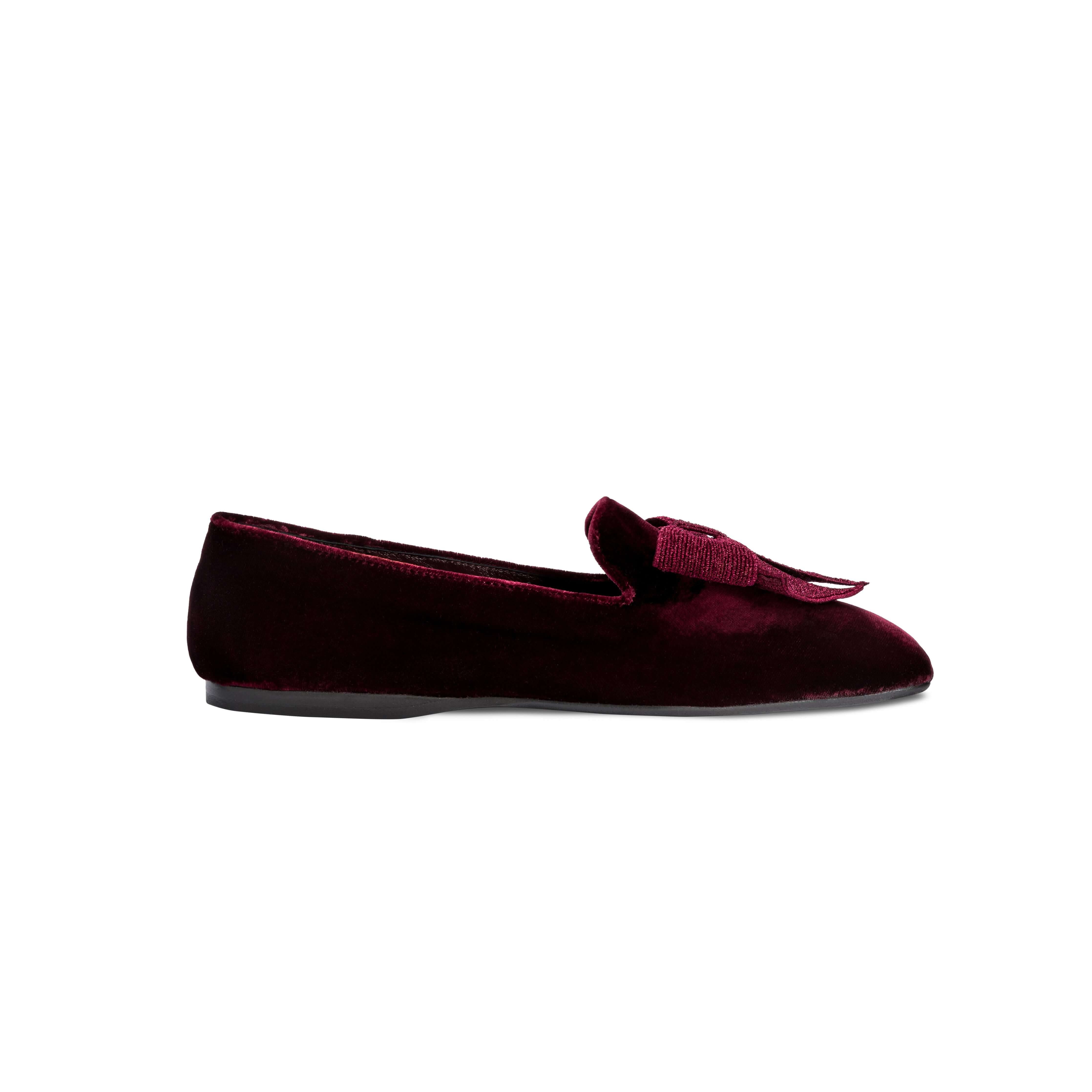 Elegant burgundy flat moccasin with metallic embroidered bow, crafted for comfort and style.