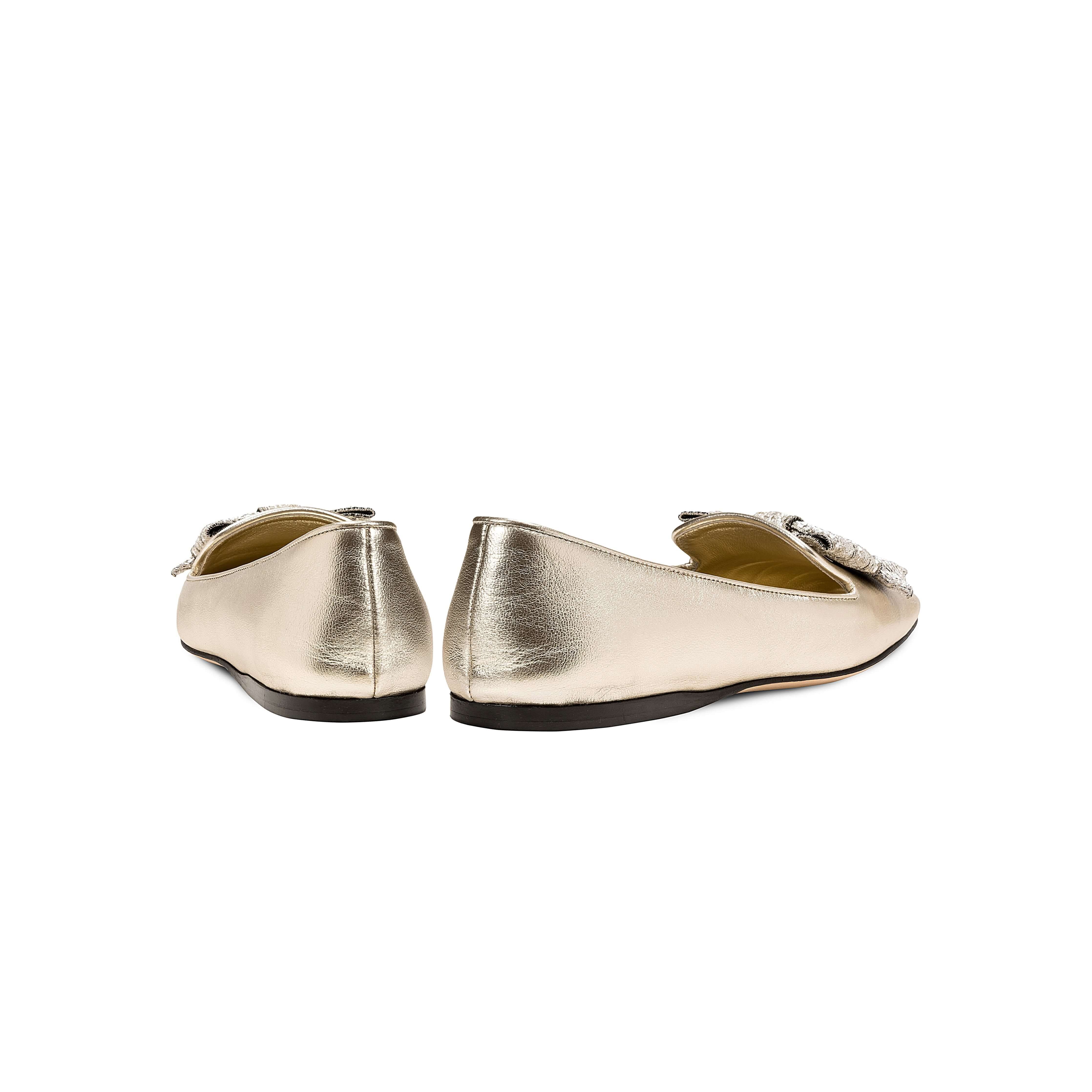 Back view of Fiocco Sahara Flat Moccasin in metallic leather with decorative bow, showcasing chic Fall footwear.