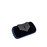 Fiocco Velvet Clutch with metallic bow detail, crafted in luxurious black velvet for elegant evening style.