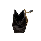 Elegant Fiora Black Pouch Bag showcasing a gold flower embellishment, perfect for evening events.