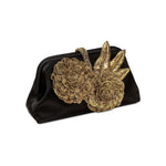 Fiora Black Pouch Bag featuring ornate gold flower embellishments, perfect for elegant evening events.