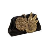 Fiora Black Pouch Bag featuring ornate gold flower embellishments, perfect for elegant evening events.