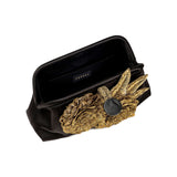 Fiora Black Pouch Bag featuring exquisite gold flower embellishment, perfect for elegant evening events.