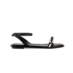 Kibele Black Ankle Cross Sandal featuring a sleek design and stylish ankle strap for a chic summer look.