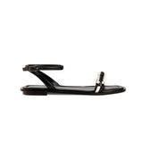 Kibele Black Ankle Cross Sandal featuring a sleek design and stylish ankle strap for a chic summer look.