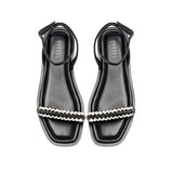 Kibele Black Ankle Cross Sandal featuring stylish braided strap design and an elegant silhouette for summer wear.