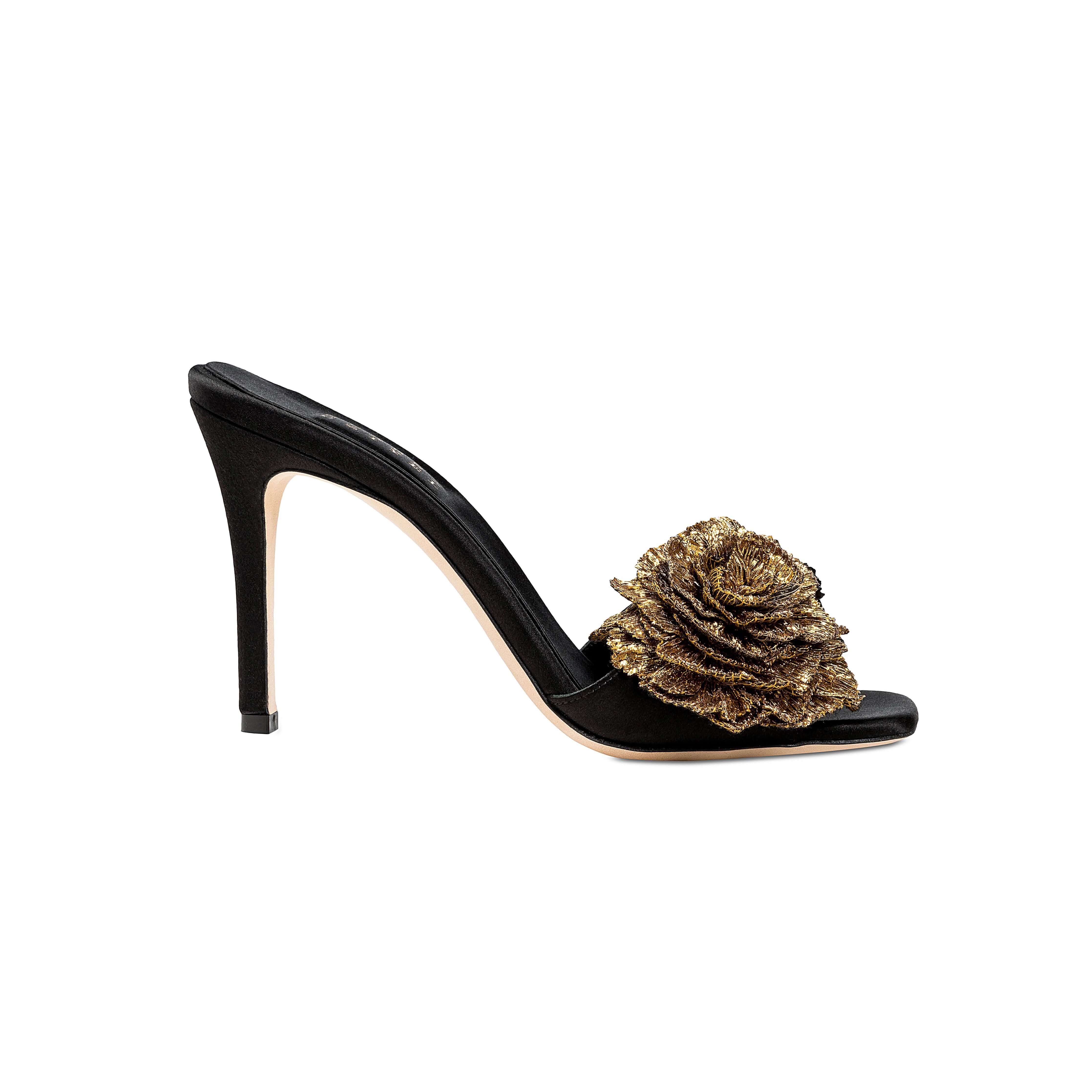 Lavinia Black High-Heel Sandal with a signature gold Florette embellishment, showcasing elegance and craftsmanship.