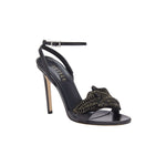 Elegant Mirales black high-heel ankle cross sandal featuring chic design and gold embellishments for a striking fashion statement.