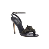 Elegant Mirales black high-heel ankle cross sandal featuring chic design and gold embellishments for a striking fashion statement.