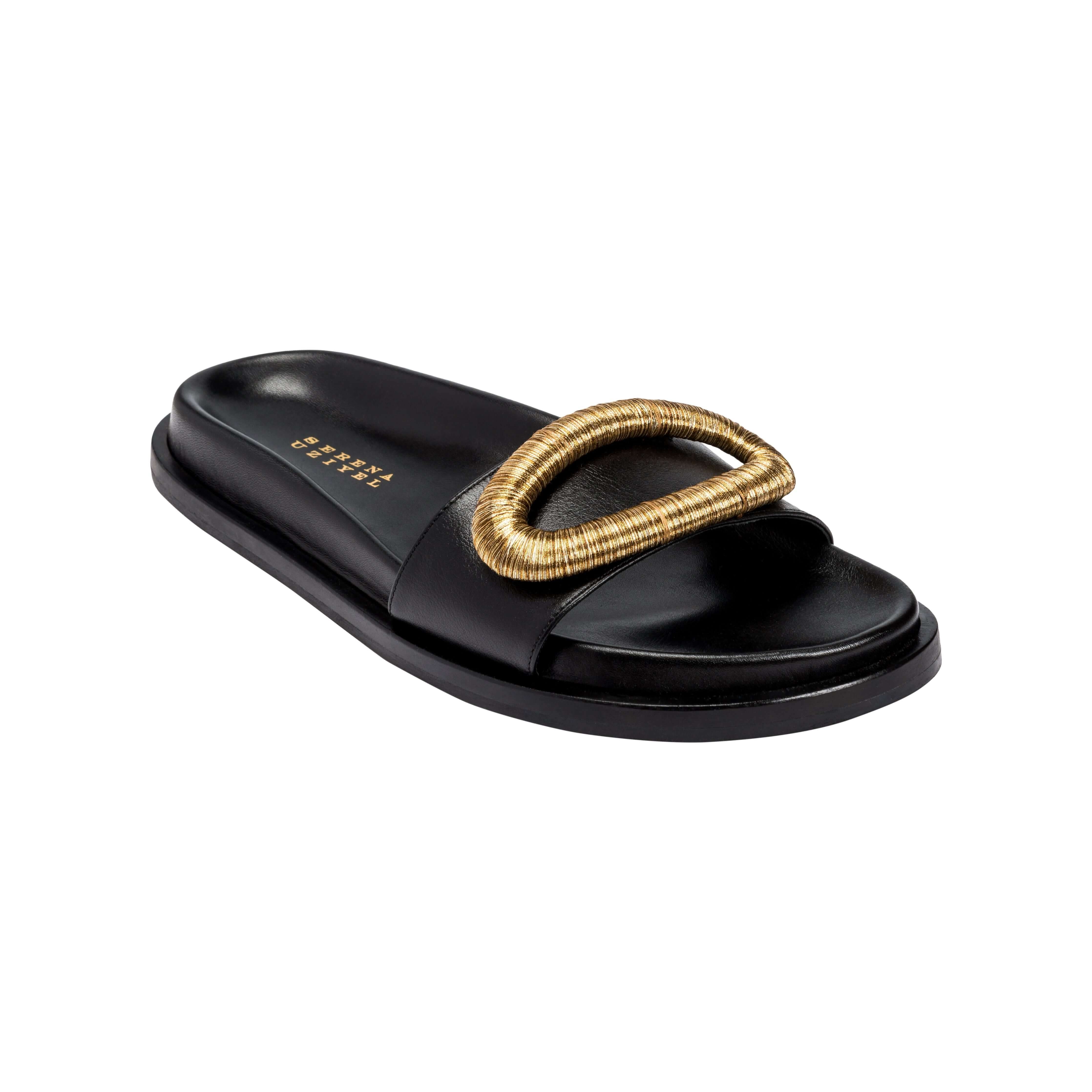 Naria Black Comfort Slide featuring a stylish gold buckle accent for chic summer footwear.