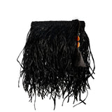 Phedora Black Clutch featuring raffia and stone design in black and almond with decorative tassel and bead accents.