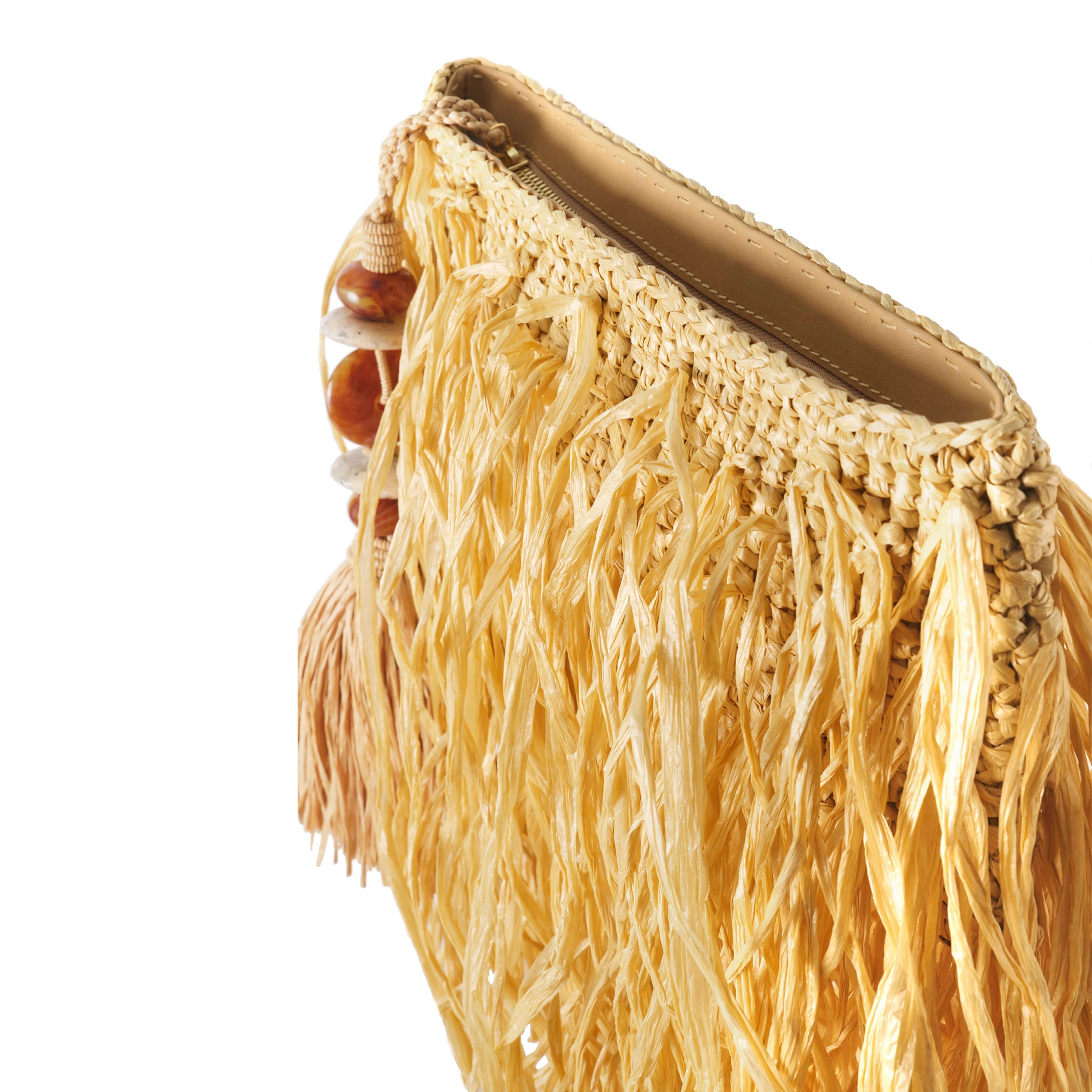 Phedora Natural Clutch featuring a stylish fringe design in vibrant yellow with bead accents.