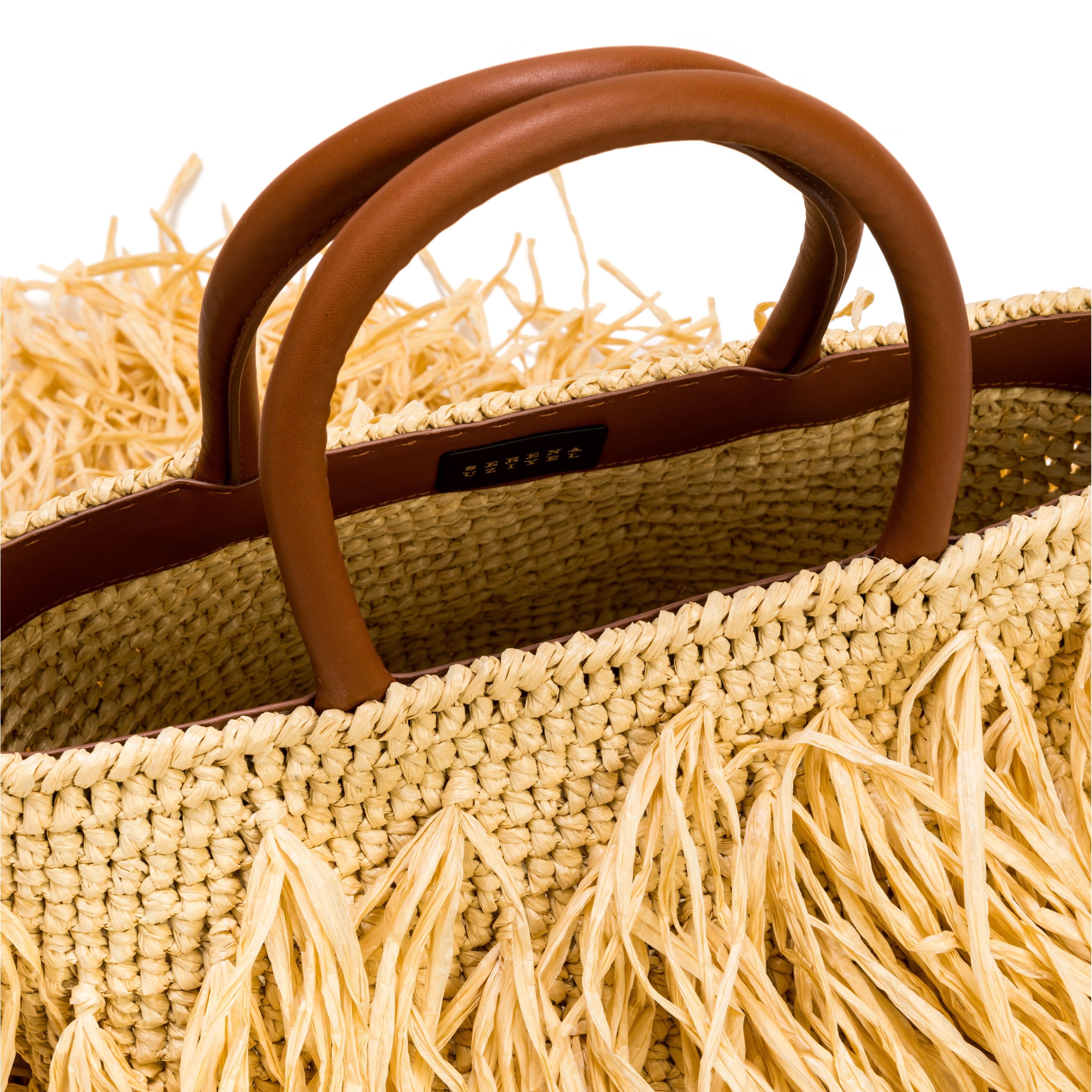 Phedora Natural Large Tote Bag featuring a stylish straw design and leather handles, perfect for summer outings.