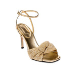 Elegant Rhea Gold Ankle Cross Sandal with metallic leather and braided crochet detailing, perfect for special occasions.