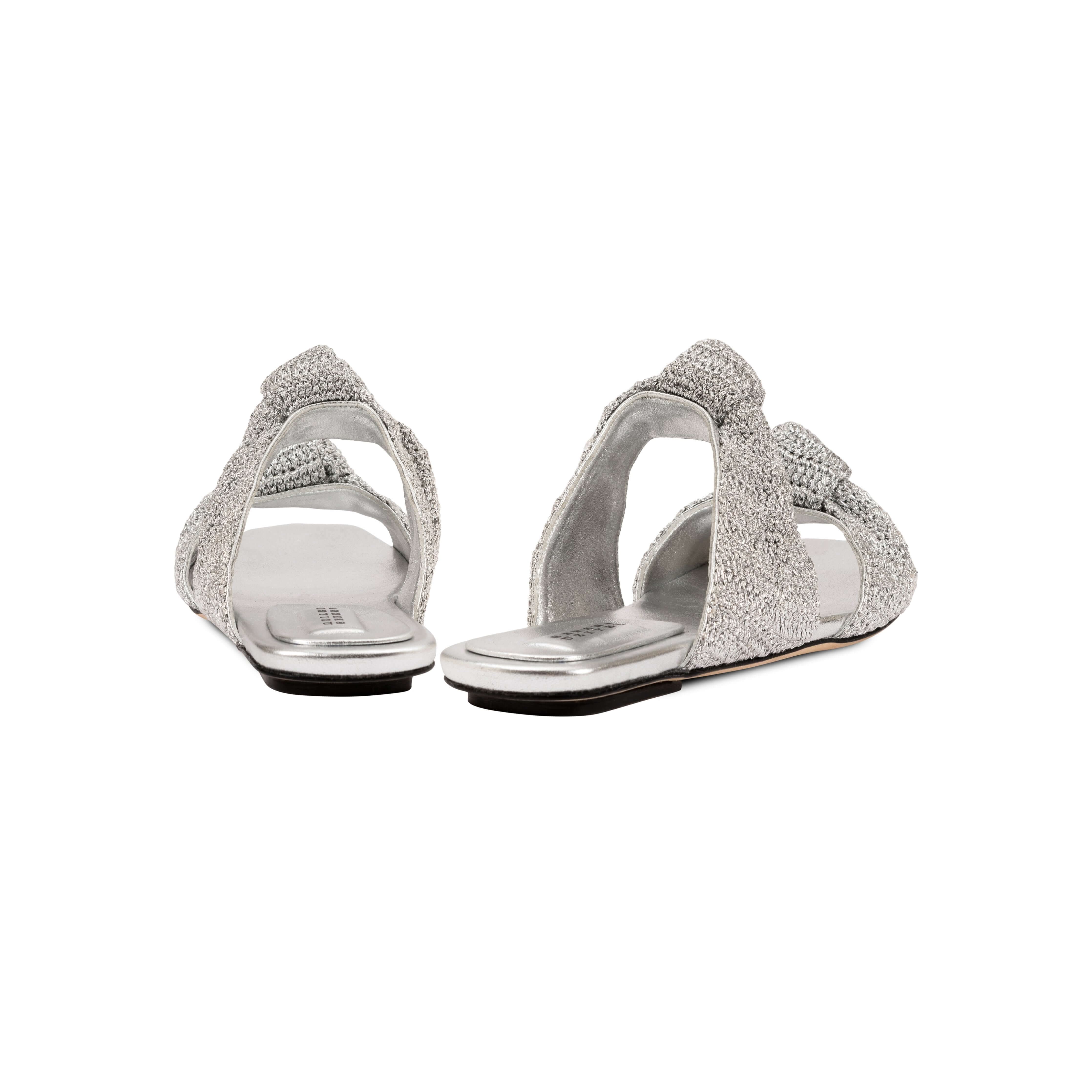 Back view of Rhea Silver Two-Strap Flat Sandal featuring knotted crochet leather straps and cushioned leather insole.