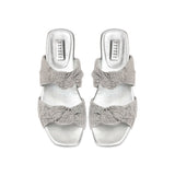 Rhea Silver 2 Knots Sandal featuring two intricately knotted crochet straps and a sleek metallic finish.