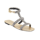 Ronda Gold Flat Gladiator Sandal featuring woven metallic rope straps in antique gold and silver.