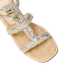Ronda natural flat gladiator sandal featuring a stylish braided design in neutral tones, perfect for summer outings.