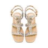 Ronda Natural Flat Gladiator Sandal with braided silver straps and natural textured sole, perfect for summer outings.