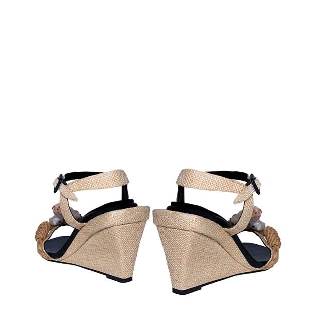 Back view of Taurea Natural Wedge Ankle Sandal with raffia material and natural stone embellishments.