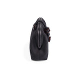 Side view of the Petra Black Pouch Bag, made of suede leather with stone embroidery, featuring a leather lining.